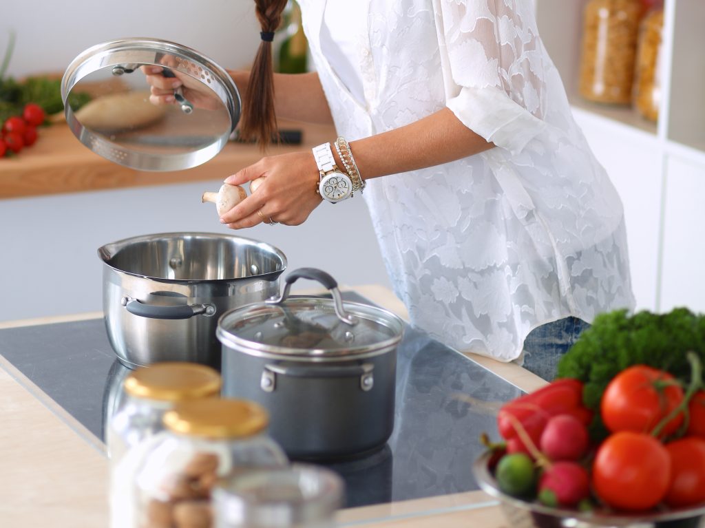 Woman Cooking Mushrooms