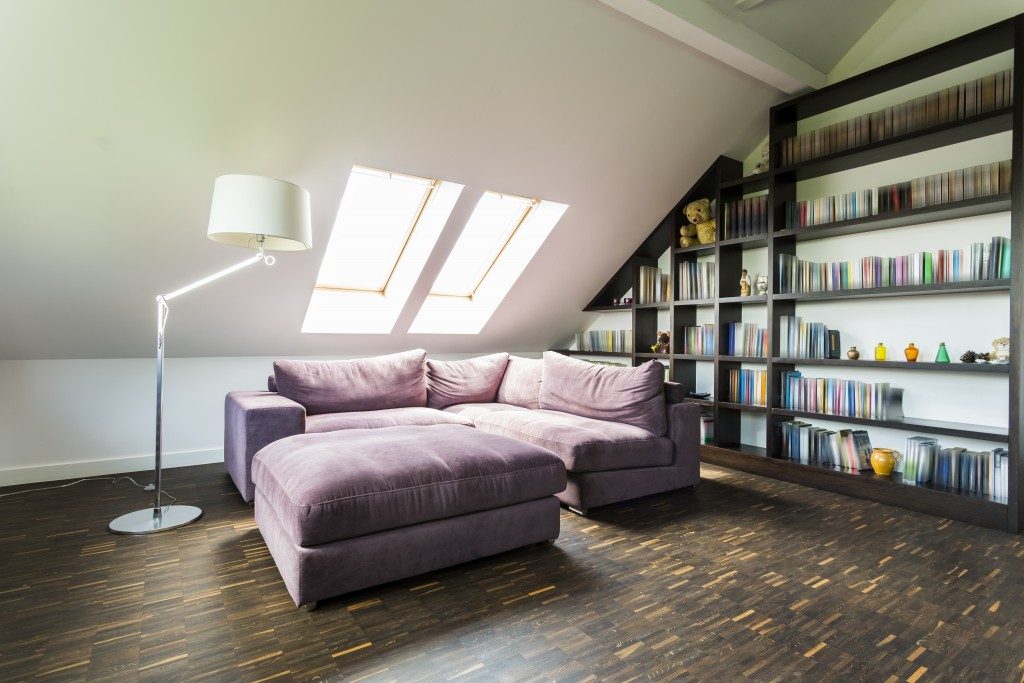a purple sofa in the attic
