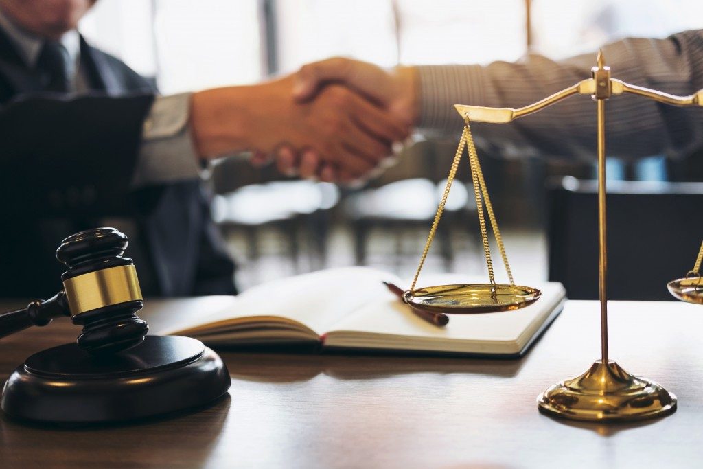 Client and lawyer shaking hands