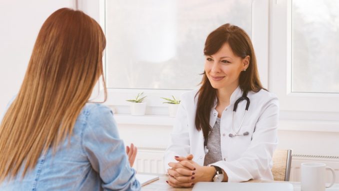 Woman Talking to a Doctor