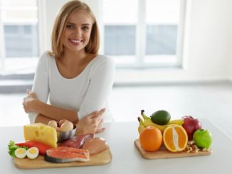 Woman with different food products in front