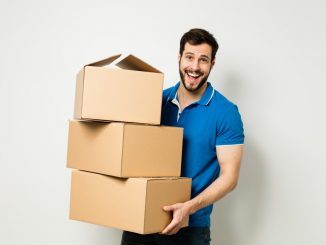 a man carrying boxes