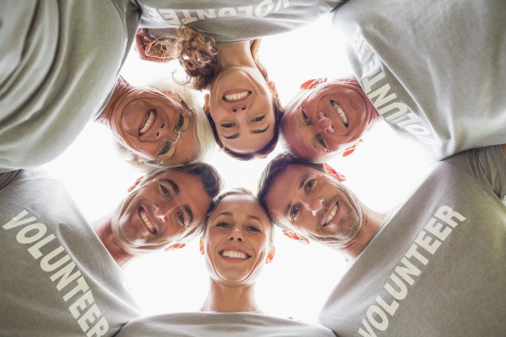 group of volunteers in a huddle