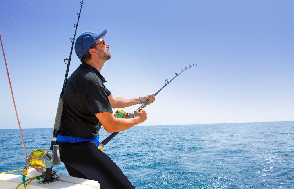 Man fishing in the middle of the ocean