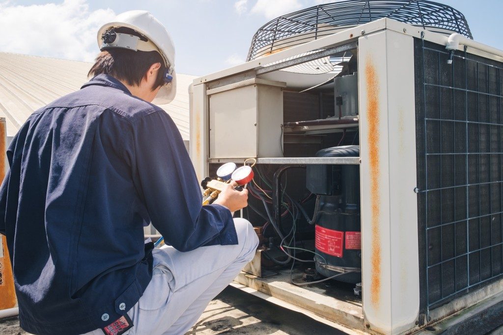 man installing water treatment