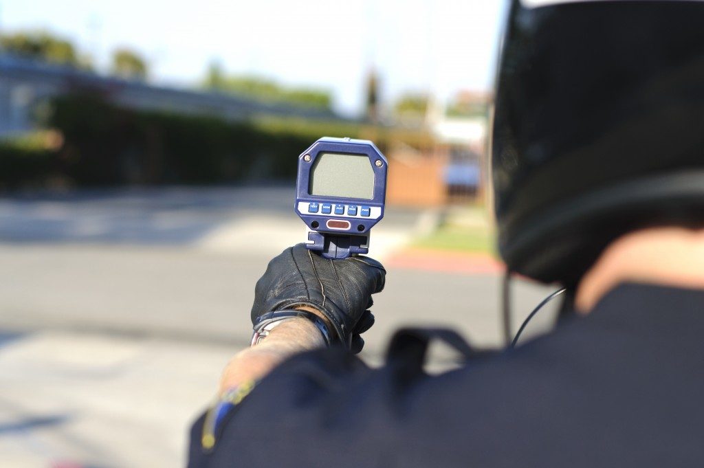police holdig a radar gun