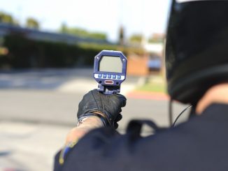 police holdig a radar gun