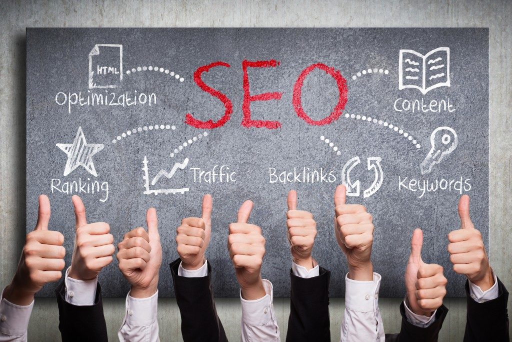 Thumbs up, SEO concept on background