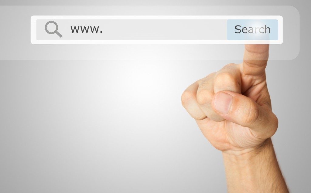 Hand pointing to the search button