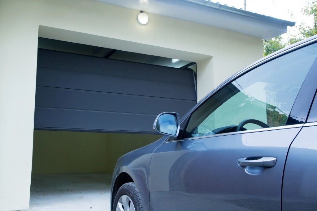 garage doors opening for a car