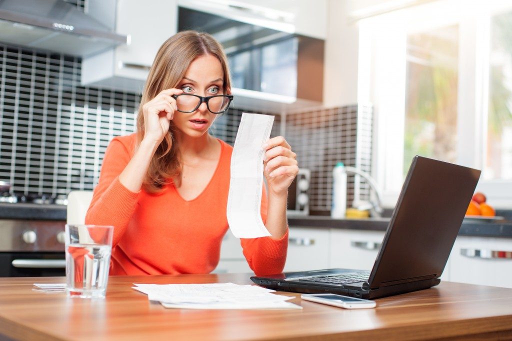 woman looking at her bills