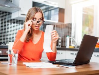 woman looking at her bills