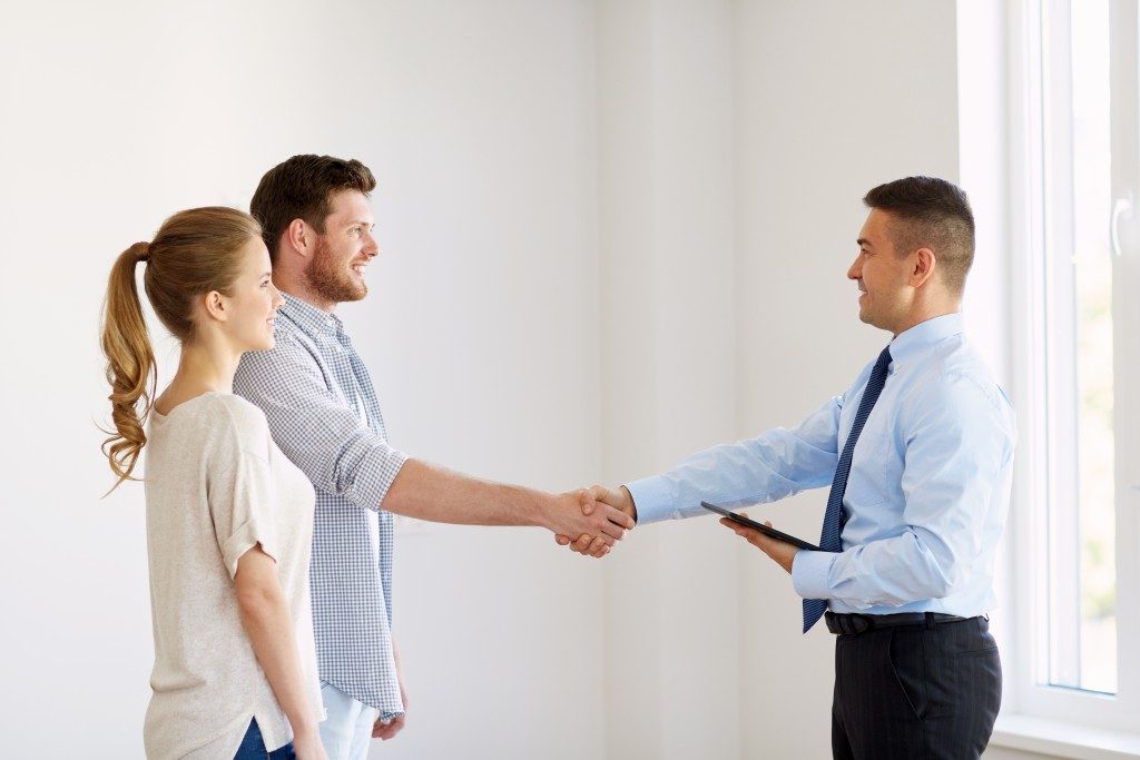 client and employee shaking hands