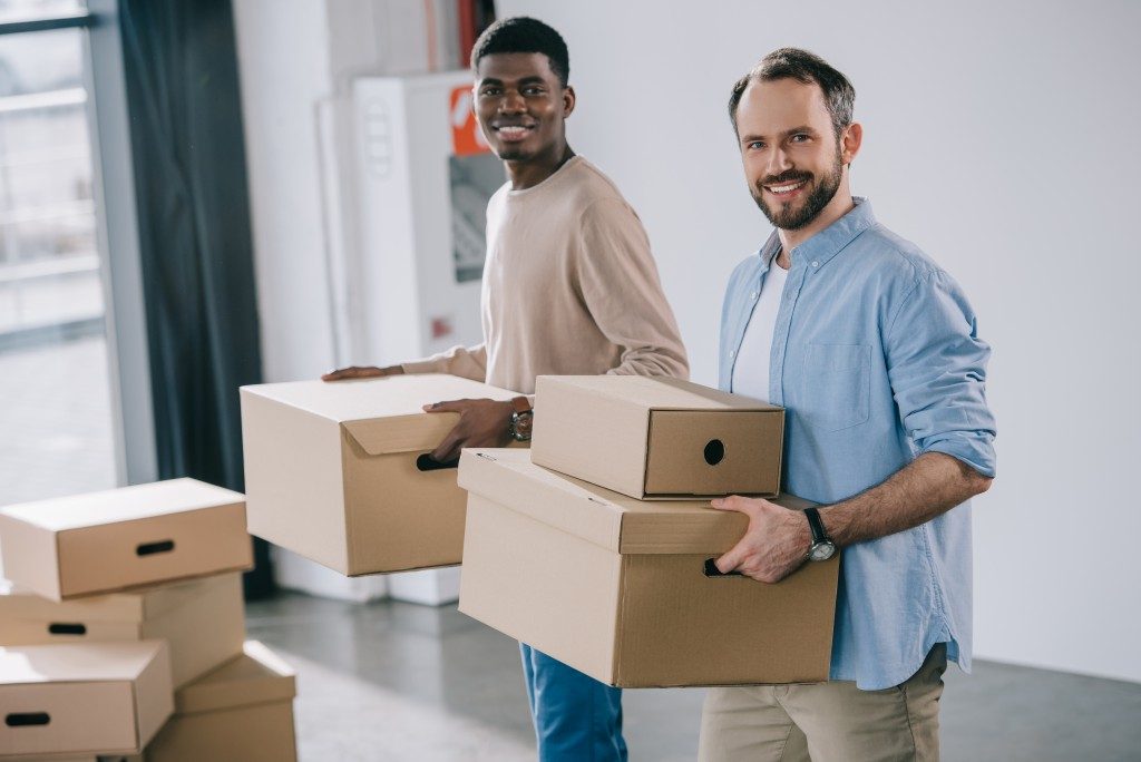 men packing their things