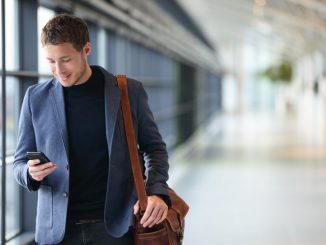 businessman on a phone walking inside the airport