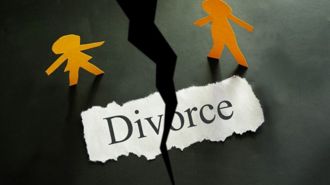 Torn piece of paper with divorce concept