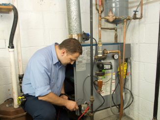 plumber fixing a gas pipe