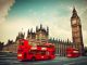 Red bus in motion and Big Ben