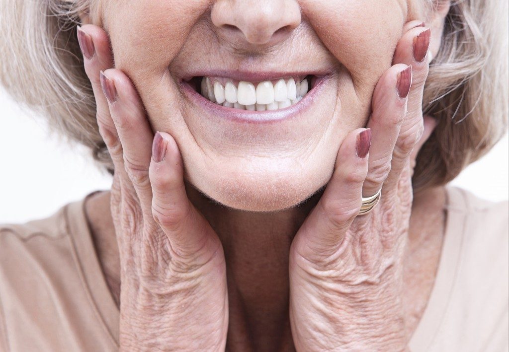 old woman showing her white teeth
