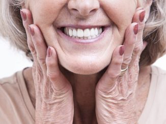 old woman showing her white teeth