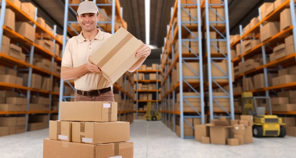 Delivery man carrying a parcel