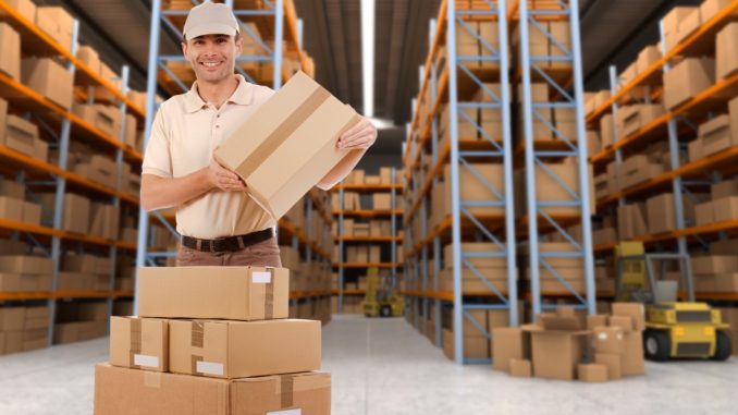 Delivery man carrying a parcel