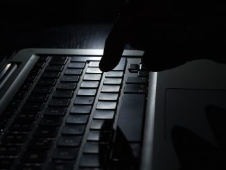 dark image of hacker's hand