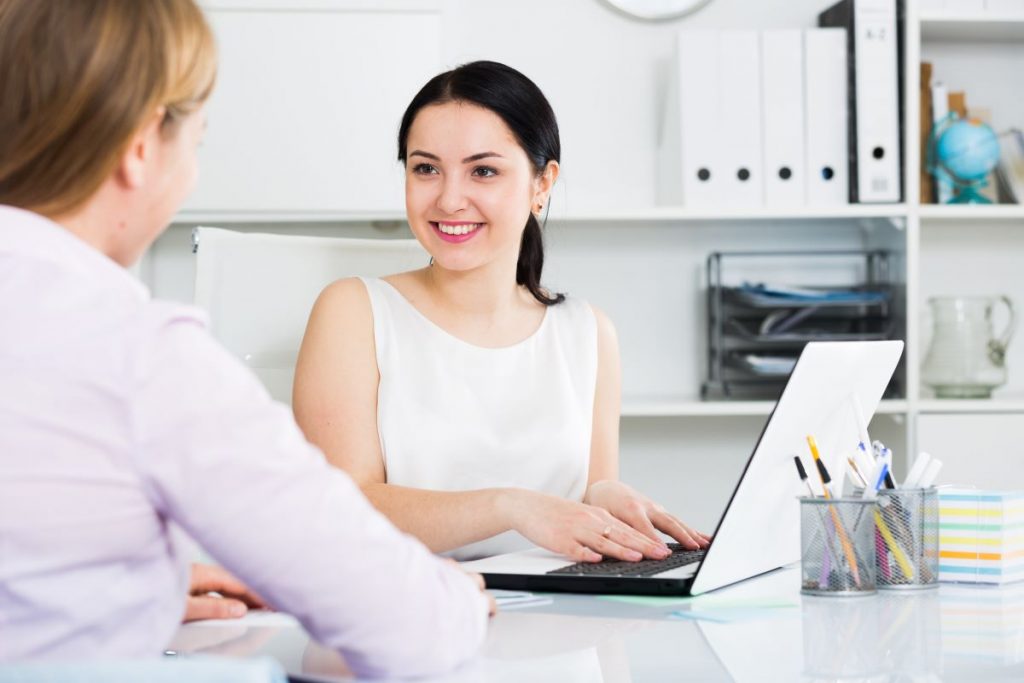 woman talking to another office mate