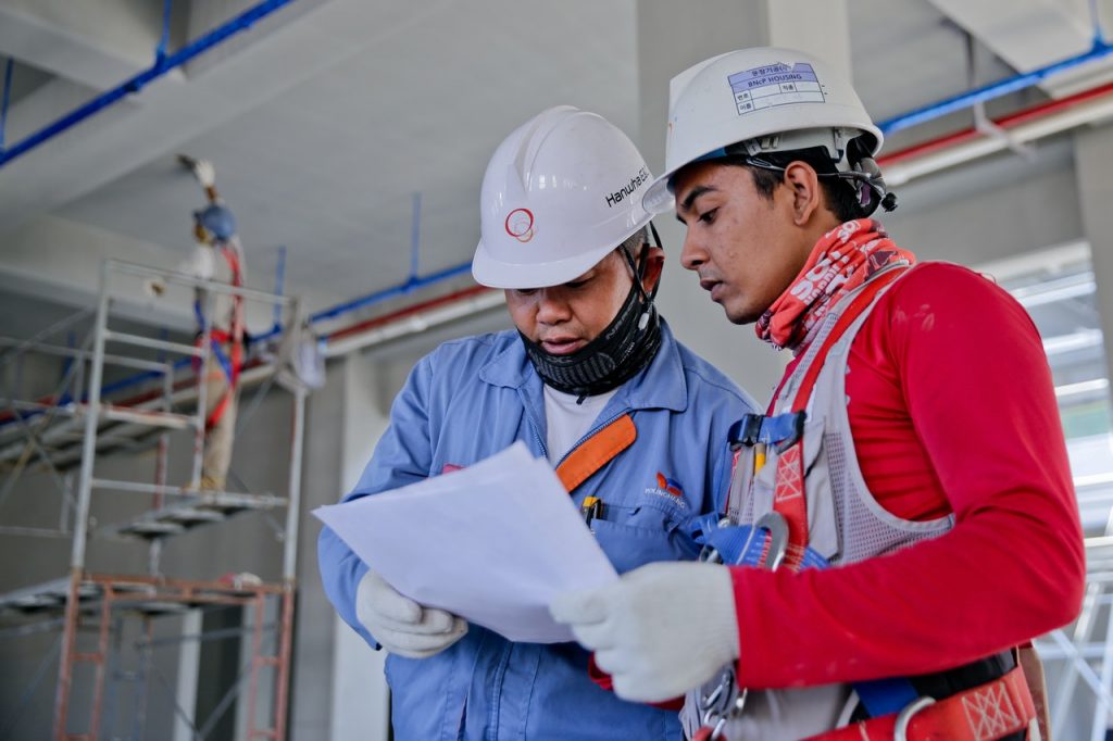 working talking to foreman engineer