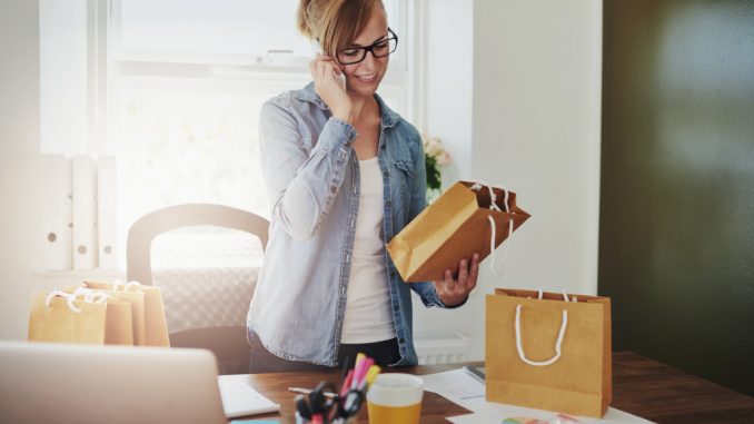 woman on phone with products